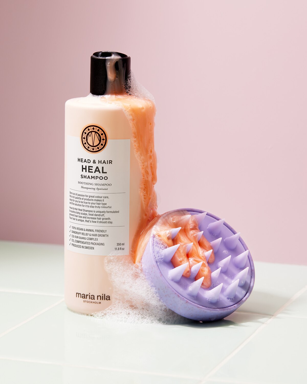 Head & Hair Heal Shampoo bottle with rich lather