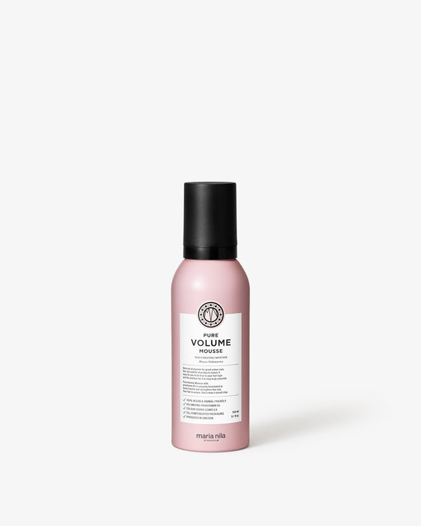 Pink bottle of Maria Nila hair product on a white background