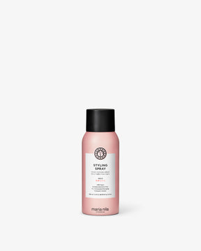 Pink bottle of Maria Nila styling spray 100ml on a white background