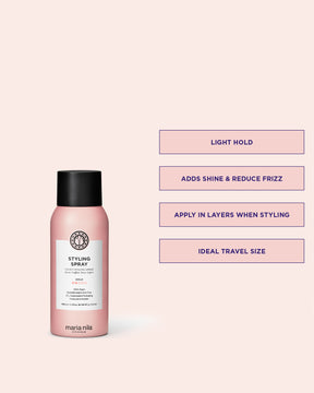 Pink bottle of Maria Nila styling spray with text on a light pink background