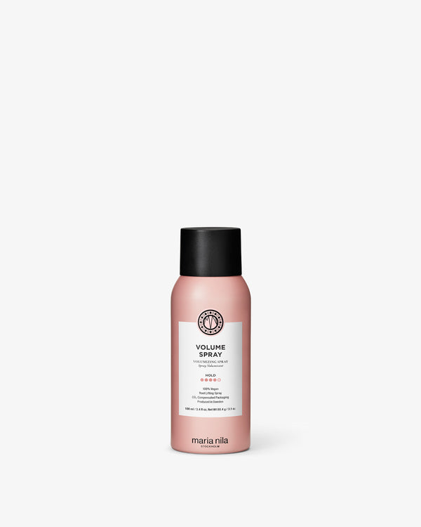Pink bottle of Maria Nila Volume Spray on a white background
