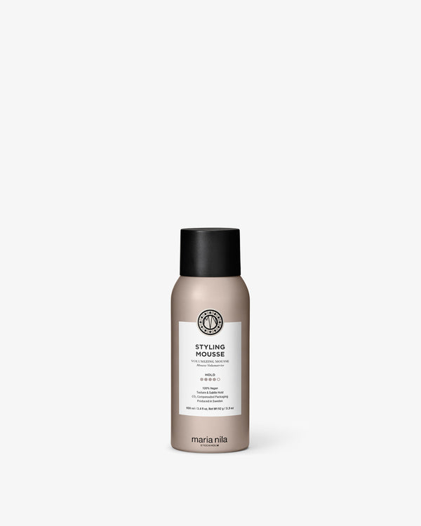 Marina Nila styling mousse bottle on a white background