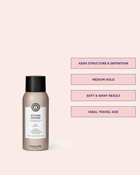 Maria Nila styling mousse bottle with product features on a pink background