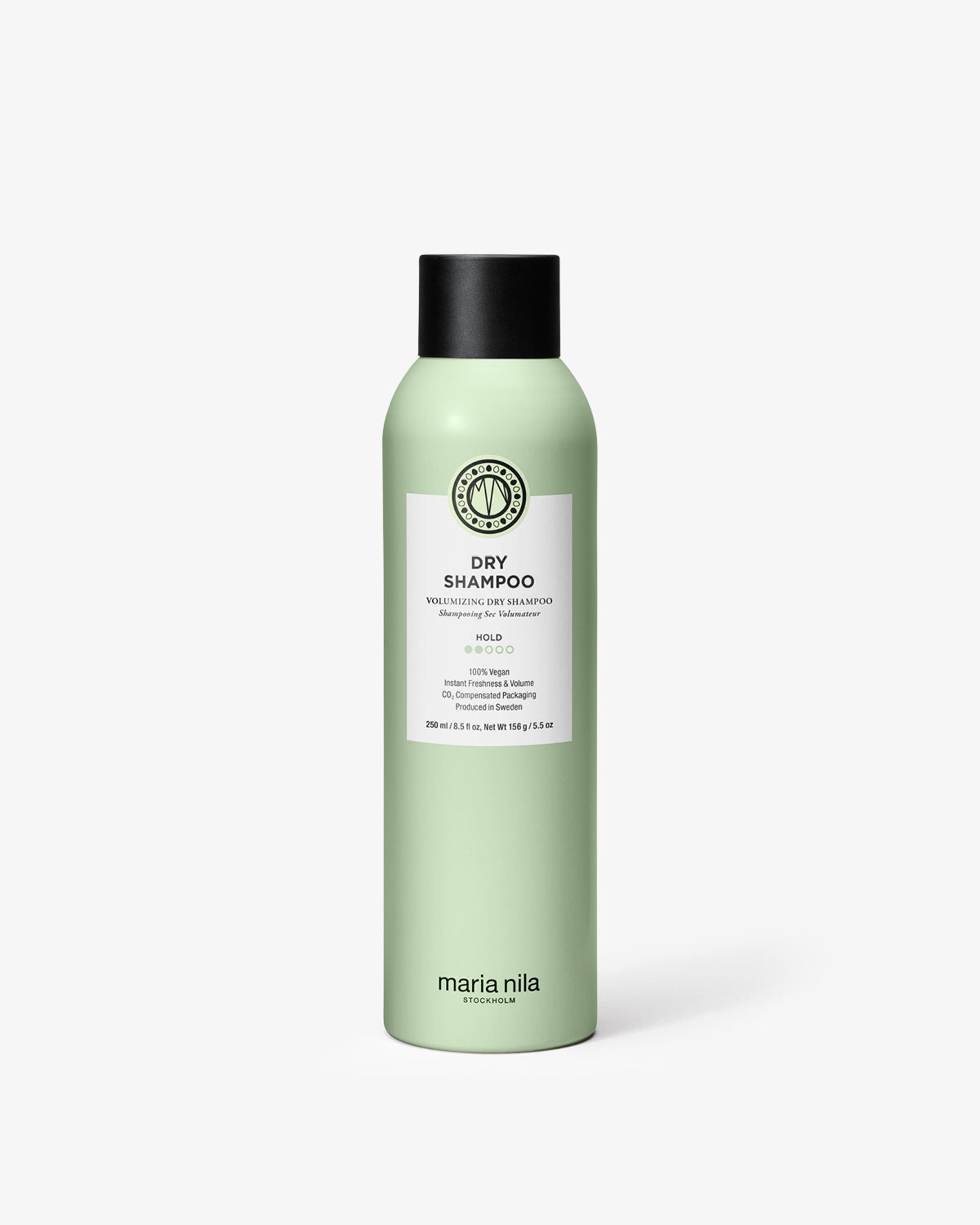 Green bottle of Maria Nila dry shampoo on a white background