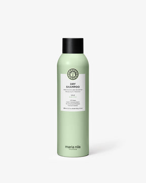 Green bottle of Maria Nila dry shampoo on a white background