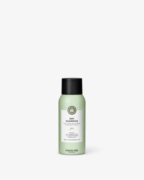 Green bottle of Maria Nila dry shampoo on a white background