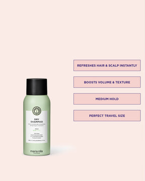 Green bottle of Maria Nila dry shampoo on a light pink background with text highlighting features.