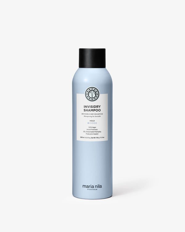 Light blue Invisidry Shampoo bottle with black cap and white label on a white background