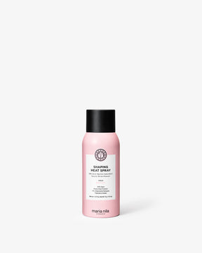 Pink spray bottle labeled 'Shaping Heat Spray' by Maria Nila on a white background