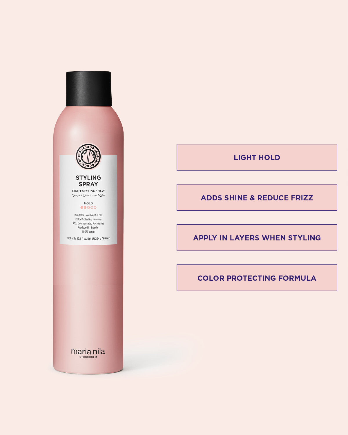 Pink bottle of Maria Nila styling spray on a light pink background with product details.