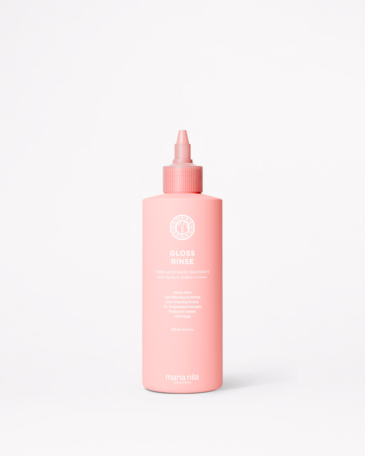 A pink bottle of Maria Nila Mirror Gloss Rinse with a pointed applicator cap, centered on a clean white background.