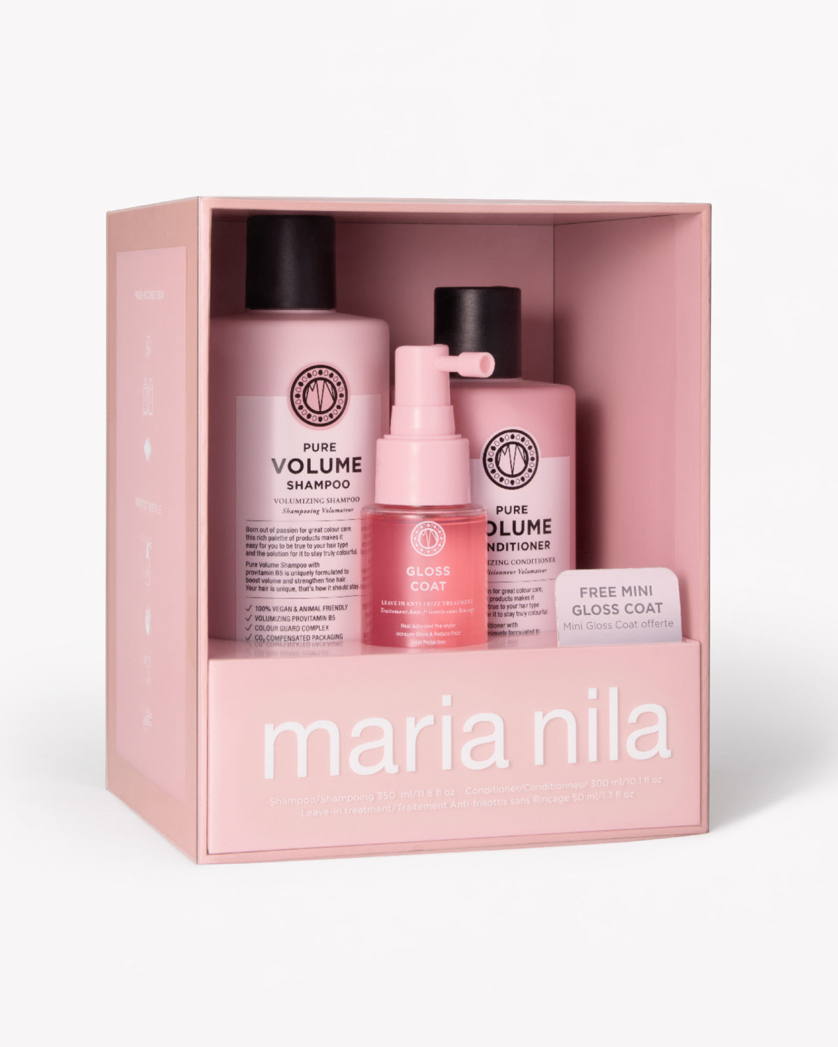 Maria Nila hair care gift set in a pink box, containing a Volume Shampoo bottle, a Volume Nourish bottle, a Gloss Coat pump bottle, and a small gloss coat card.