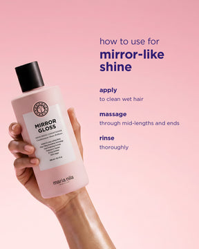 Hand holding a pink bottle of Mirror Gloss Conditioner against a soft pink background with usage instructions text.