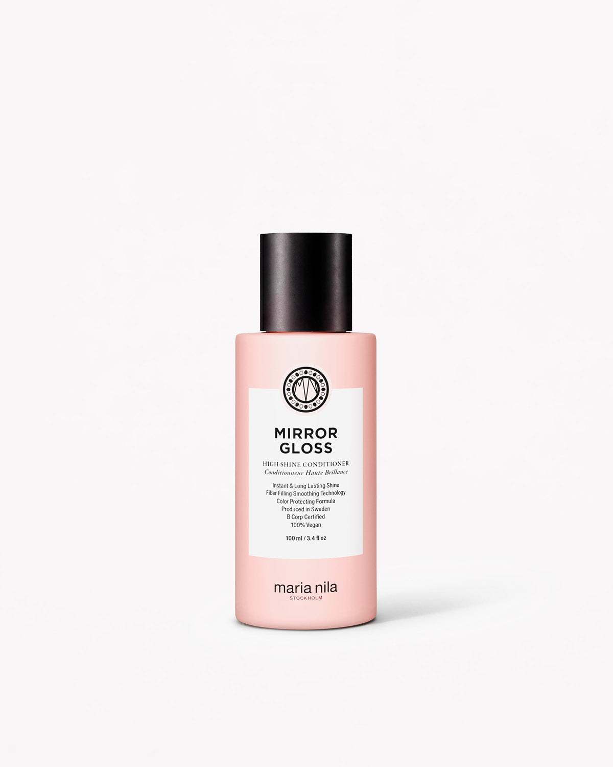 Pink travel-sized Mirror Gloss Conditioner bottle with black cap and white label by Maria Nila.