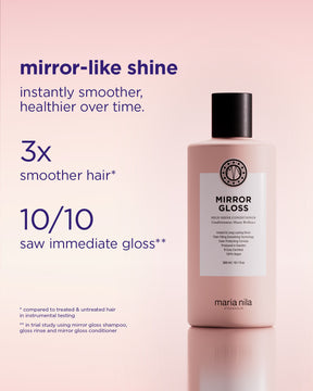 Bottle of pink Mirror Gloss Conditioner with black cap and label highlighting smoothness and shine benefits.
