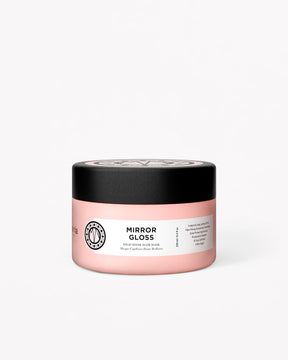 Pink jar of Mirror Gloss Mask with black lid and white label detailing product info.