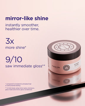 Pink jar of Mirror Gloss Mask with black lid and glossy reflective surface under soft lighting.
