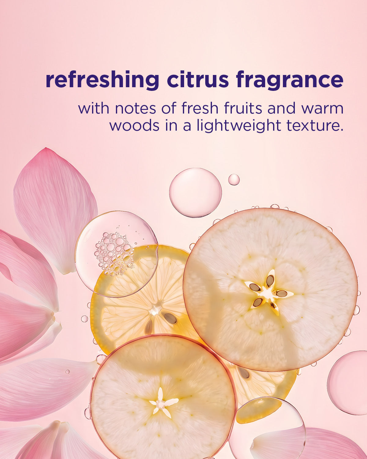 Transparent circular slices of citrus fruits with pink flower petals and water droplets on a soft pink background.