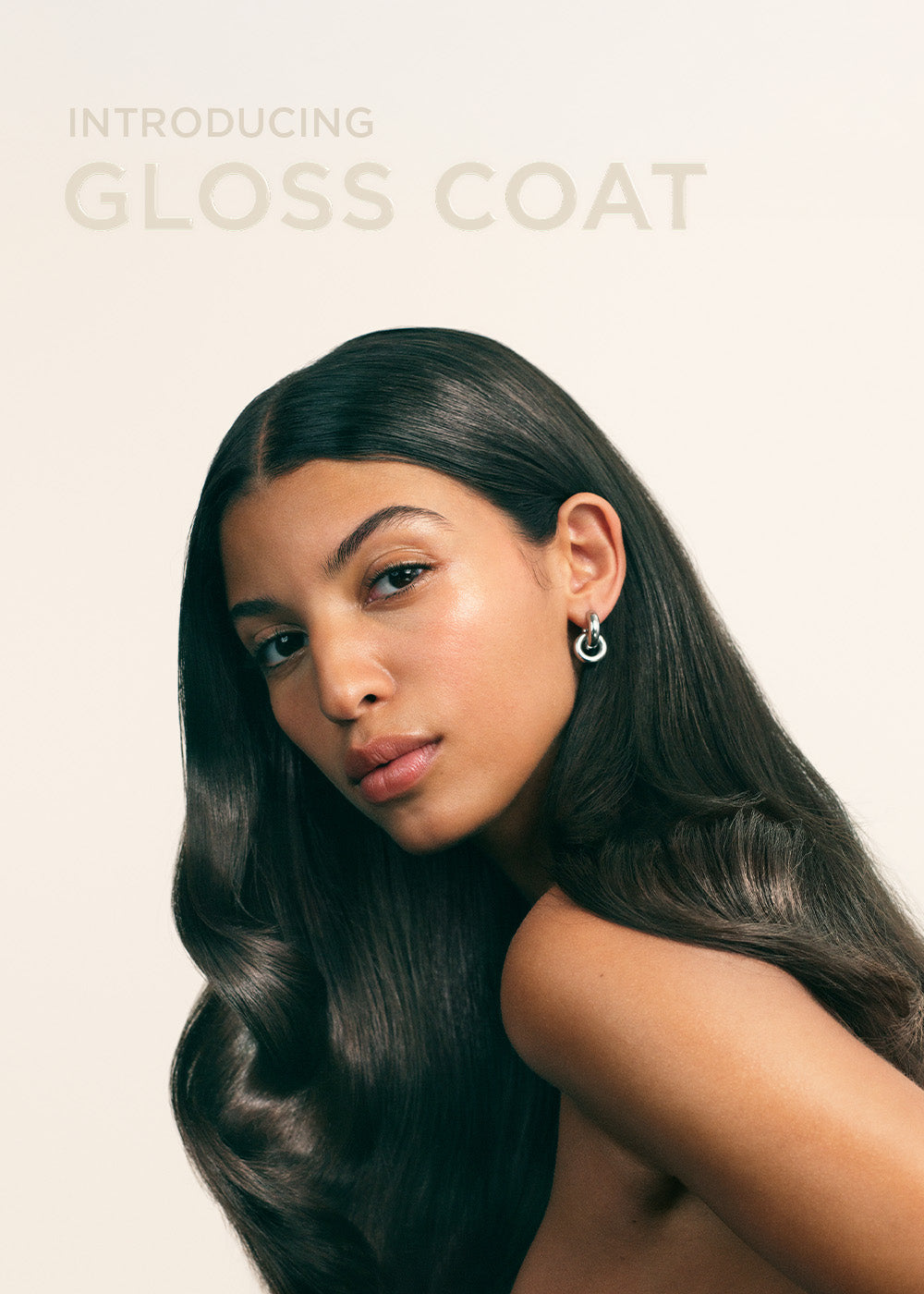 Model with glossy hair and textIntroducing Maria Nila Gloss Coat