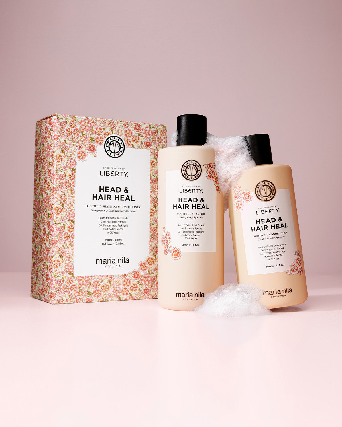 Maria Nila head & hair heal products with exclusive for liberty packaging on a pink background