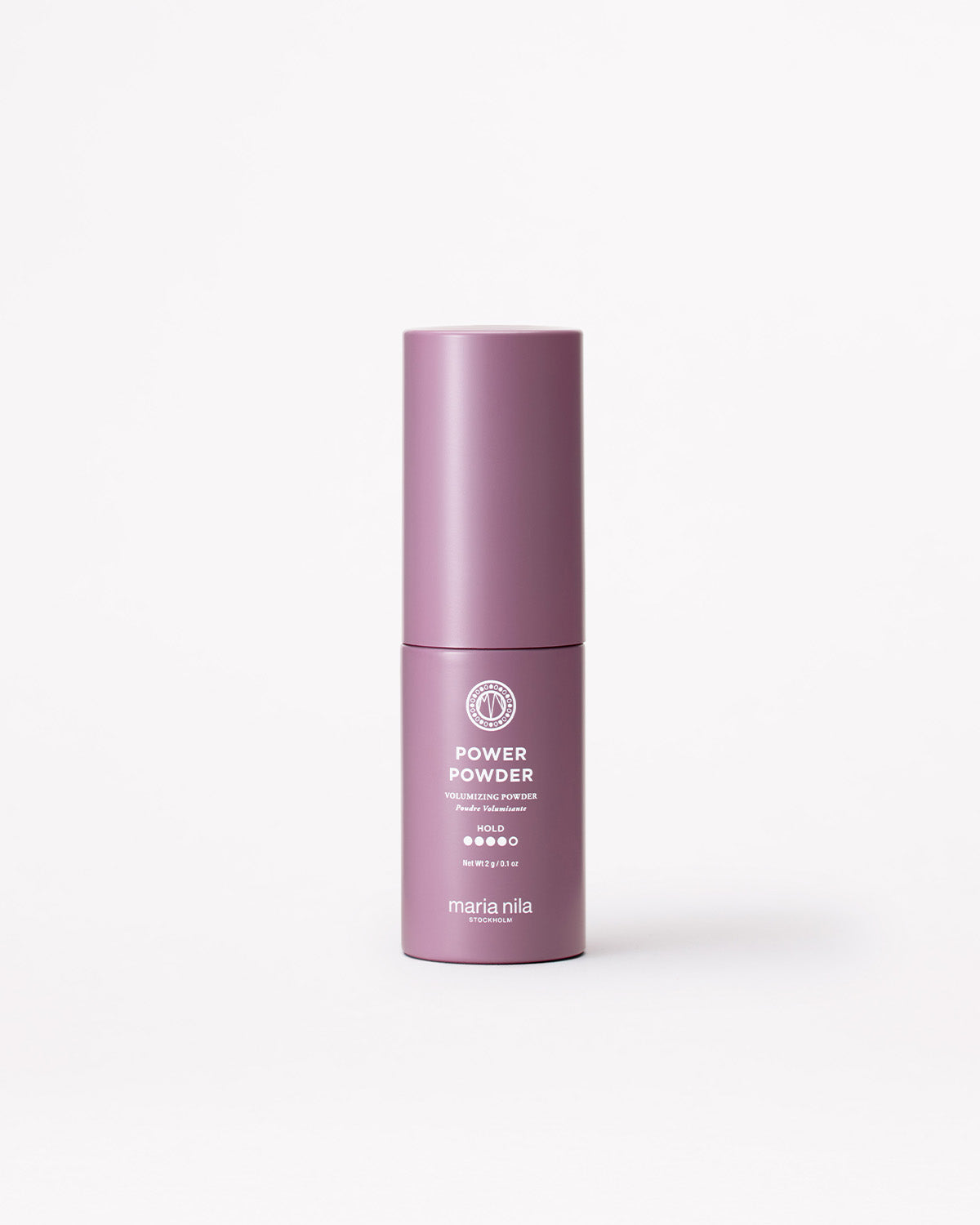 A matte mauve-pink cylindrical cosmetic bottle labeled 'POWER POWDER' and 'maria nila' on a clean white background.