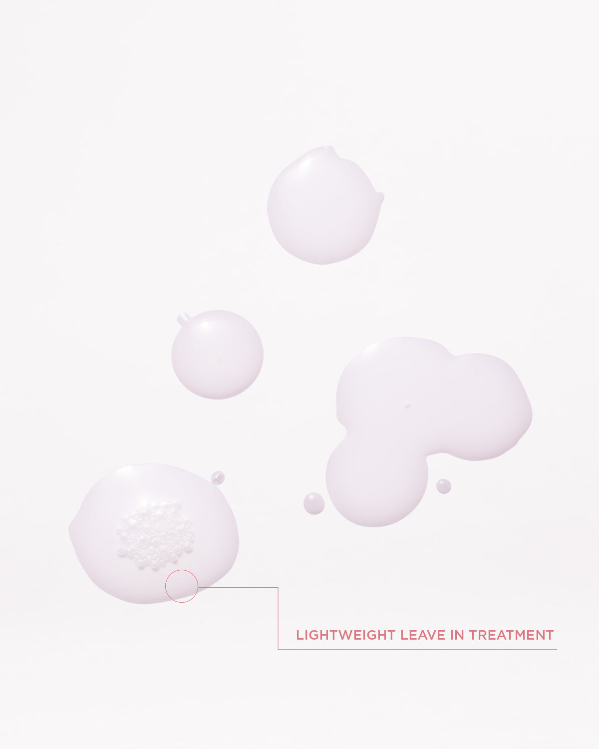 Lightweight leave-in Gloss Coat droplets on a soft pink background