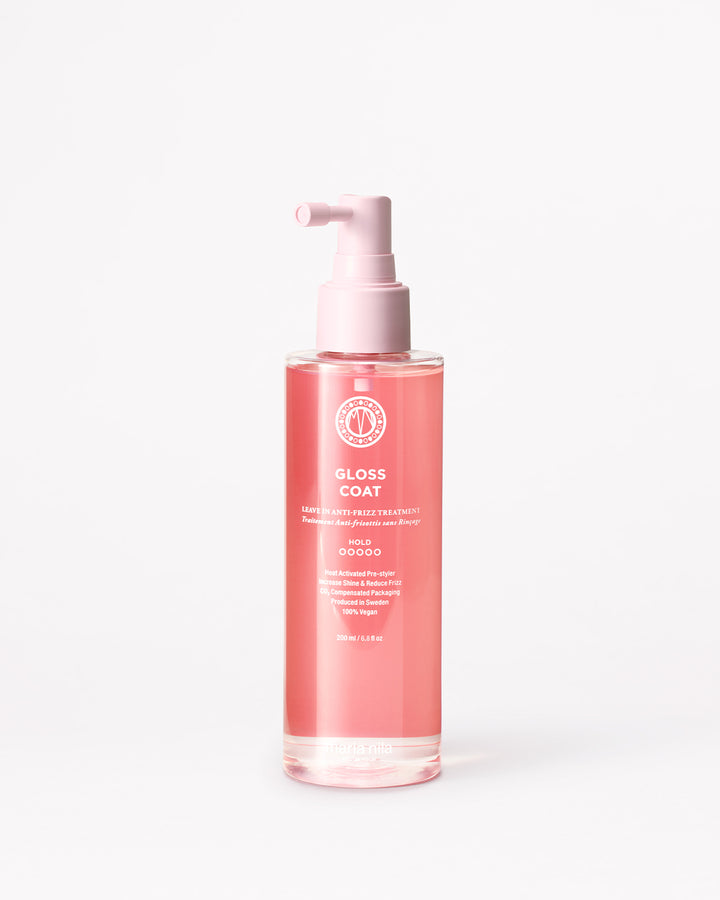 Bottle of 'Gloss Coat' hair product on a white background